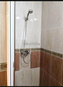 a shower with a shower head in a bathroom at KAKTUS BEACH House in Corralejo