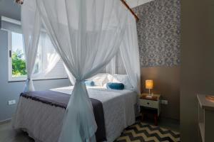 En eller flere senge i et værelse på Calamar Flats Paraty