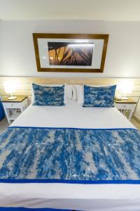 A bed or beds in a room at Hotel Marqués del Mar