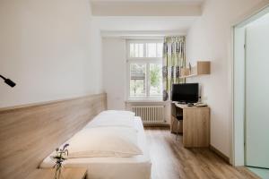 TV a/nebo společenská místnost v ubytování Hotel Kolping