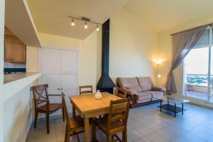 a kitchen and living room with a table and a couch at B-5 BEGUR 4 PaX in Begur