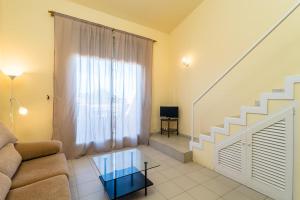 a living room with a couch and stairs at B-5 BEGUR 4 PaX in Begur