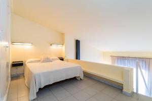 a bedroom with a bed and a large window at B-5 BEGUR 4 PaX in Begur