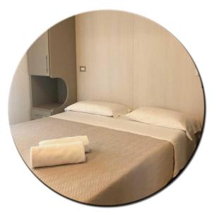 Posteľ alebo postele v izbe v ubytovaní Hotel Amedea