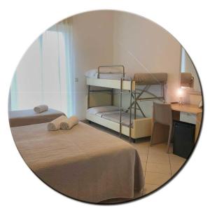 Posteľ alebo postele v izbe v ubytovaní Hotel Amedea