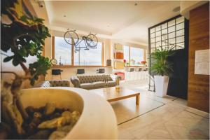 a living room with a couch and a table at Hotel Continental in Reggio di Calabria