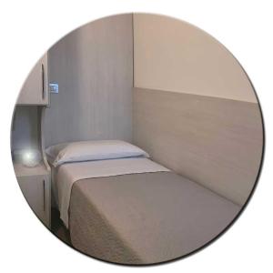 Posteľ alebo postele v izbe v ubytovaní Hotel Amedea