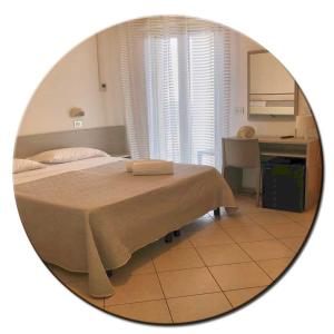 Posteľ alebo postele v izbe v ubytovaní Hotel Amedea