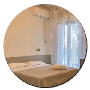 Posteľ alebo postele v izbe v ubytovaní Hotel Amedea