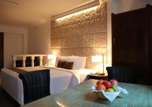 Postel nebo postele na pokoji v ubytování Inkari Suites Hotel