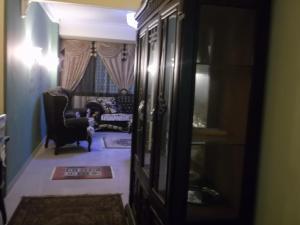 a hallway with a living room with a couch at One-Bedroom Apartment at El Maali Street in Cairo