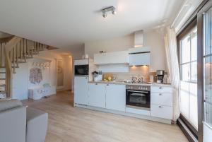 Kuchyň nebo kuchyňský kout v ubytování Haus am Strand Ferienwohnung Haus am Strand 3