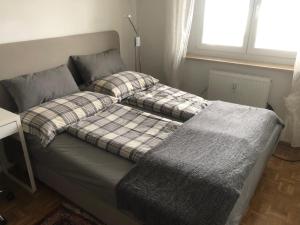 Łóżko lub łóżka w pokoju w obiekcie City Apartments Klinikum