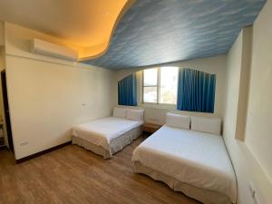 Letto o letti in una camera di 台東1314電梯民宿