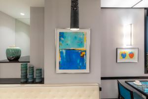 a room with a painting on the wall and a bench at Montfleuri in Paris