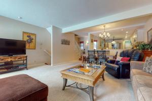 a living room with a couch and a table at Moran B in Jackson