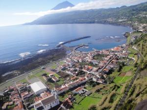 an aerial view of a town next to a body of water at One bedroom appartement with sea view terrace and wifi at Lajes Do Pico in Lajes do Pico