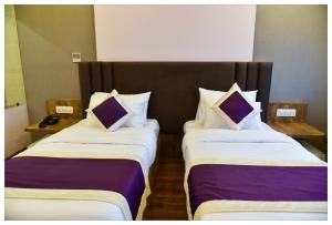 Postel nebo postele na pokoji v ubytování Hotel Siddharsh Heritage