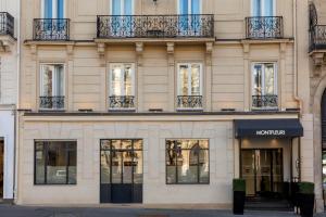 a store front of a building with windows at Montfleuri in Paris