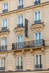 a building with balconies and a sign on it at Montfleuri in Paris