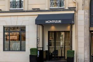 a store front of a building with a black awning at Montfleuri in Paris