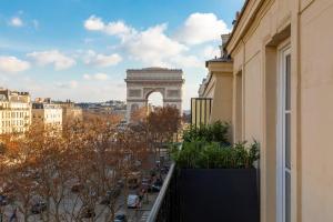 a view of the arc de triomphe from a balcony of a building at Montfleuri in Paris
