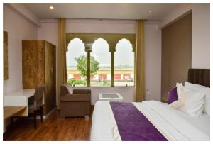 Postel nebo postele na pokoji v ubytování Hotel Siddharsh Heritage