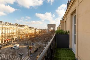 a balcony with a view of a street and buildings at Montfleuri in Paris