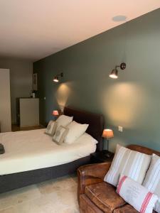 Postel nebo postele na pokoji v ubytování Le clos des oliviers