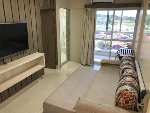 TV a/nebo společenská místnost v ubytování Piazza Diroma com acesso Acqua Park e Splash
