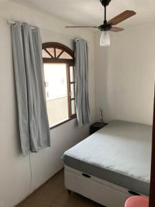 Ένα ή περισσότερα κρεβάτια σε δωμάτιο στο Casa de Praia em Ubu