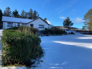 a house with snow in front of it at Glendale View in Glendale