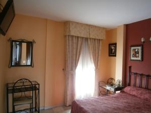 Voodi või voodid majutusasutuse Hostal Almanzor toas