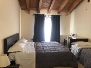 A bed or beds in a room at IL Borgo