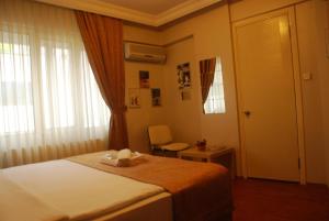 Postel nebo postele na pokoji v ubytování Mini Hotel