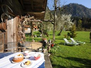 a table with a plate of food on top of it at Hansenbauernhof in Ruhpolding