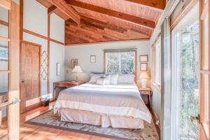 a bedroom with a bed and a window at 38445 Reed - Meredith Lodging in Manzanita