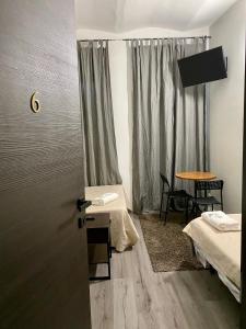A bed or beds in a room at Guest House Minas
