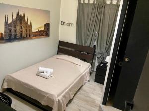 A bed or beds in a room at Guest House Minas