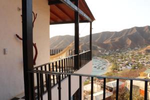 a balcony with a view of a river and mountains at Casa Blanca - Taganga in Santa Marta