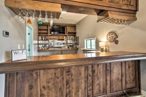 a bar with a wooden counter in a room at Starkvegas Clubhouse about 2 Mi to MSU Campus! in Starkville