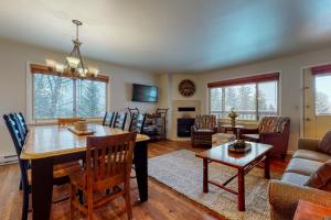 a dining room and living room with a table and chairs at 2502 Pitchfork in Jackson