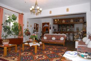 a living room with a couch and a table at Afroditi in Panormos Skopelos