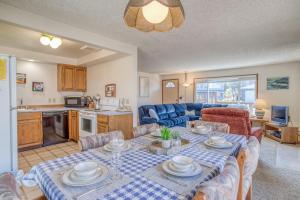 a living room with a dining table and a kitchen at Sea Gem MCA 395 - Meredith Lodging in Manzanita +28 photos