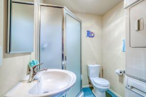 a bathroom with a sink and a toilet at Sea Gem MCA 395 - Meredith Lodging in Manzanita