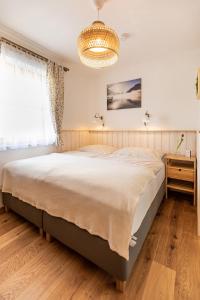 En eller flere senge i et værelse på Tonis Apartment