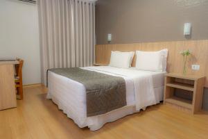 Postel nebo postele na pokoji v ubytování Hotel Rafain Centro
