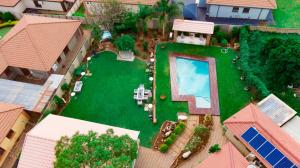 an overhead view of a backyard with a swimming pool at Mhulu Signature Boutique Hotel in Pretoria