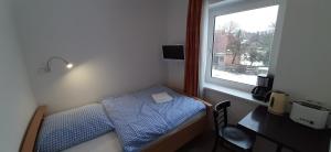 Postel nebo postele na pokoji v ubytování Schillers Landhaus