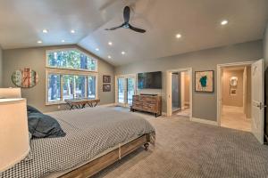 a bedroom with a bed and a ceiling fan at 4 Mi to Dtwn Truckee Tahoe Donner Home with Hot Tub in Truckee